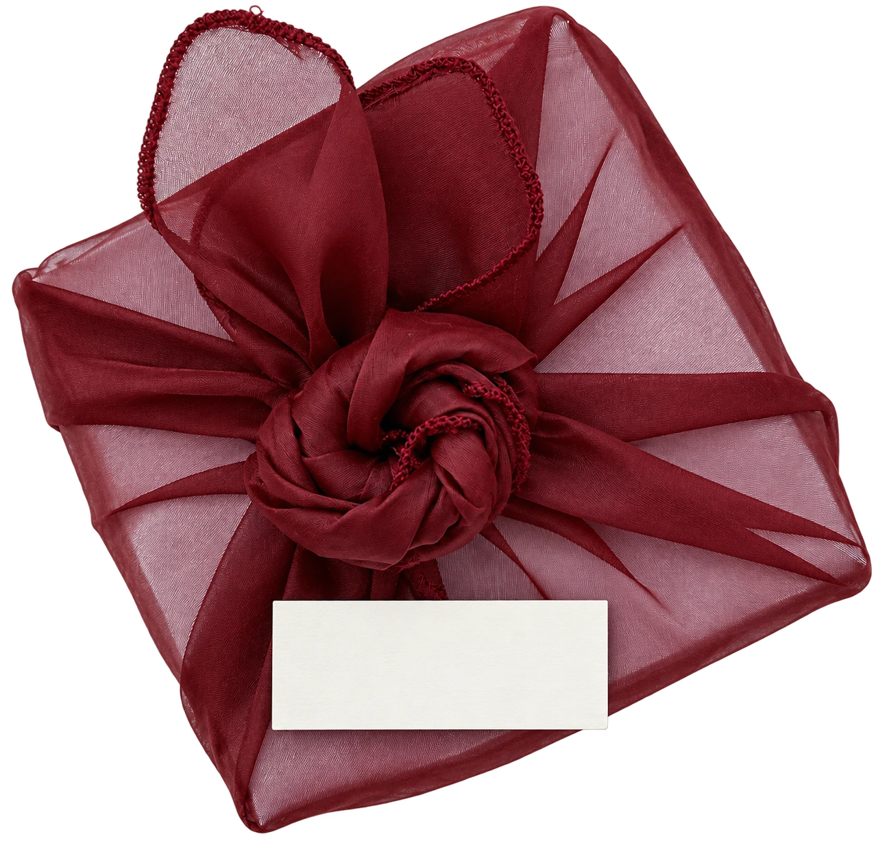 Regalo envuelto en organza granate con una tarjeta que dice Avec amour